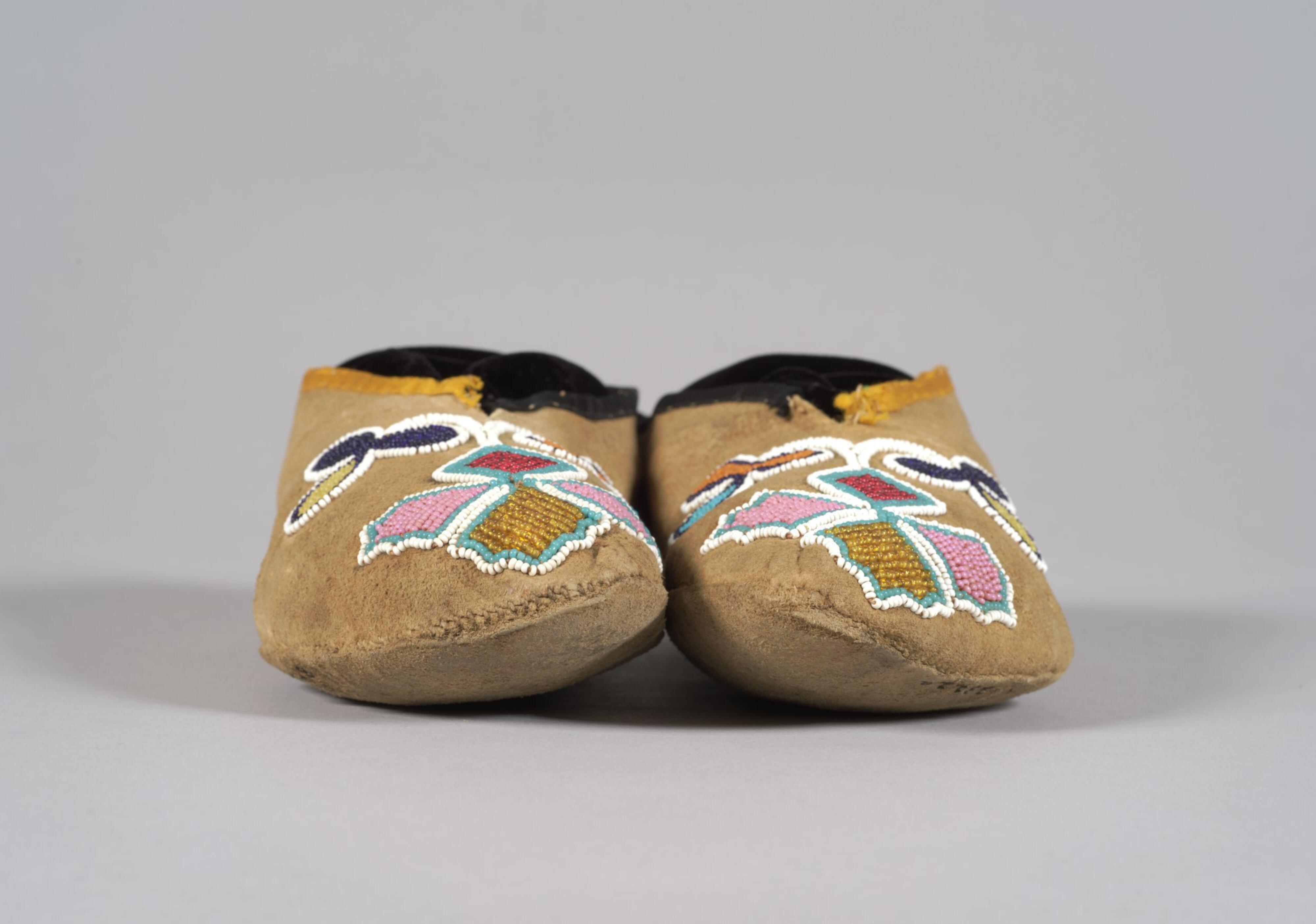 Woman's leather moccasins with beaded floral designs / Unknown