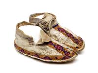Child’s beaded leather moccasins with geometric designs