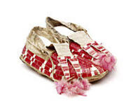 Men's quilled leather moccasins with split tongue and metal cone tassels